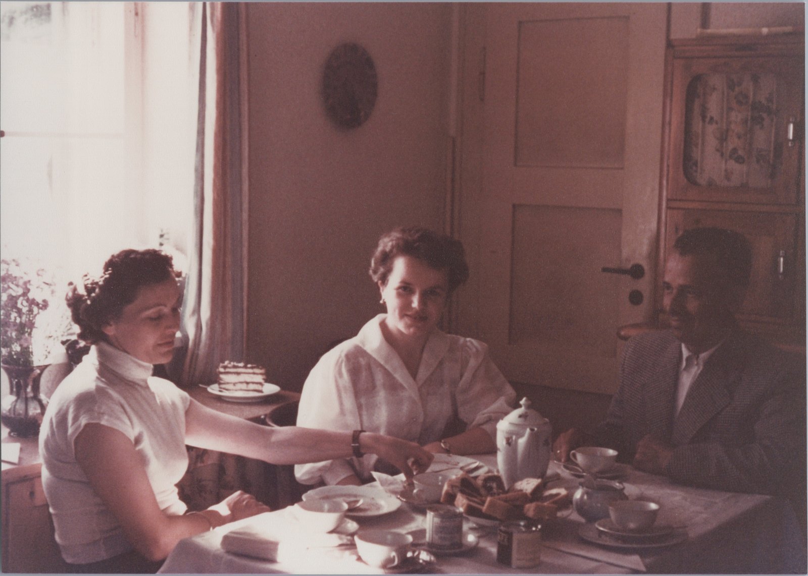 Three people seated at a table